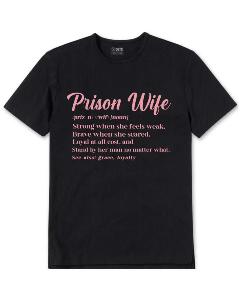 A t-shirt with a Prison wife definition that reads"Prison Wife: A woman that's strong when she feels weak, brave when she feels scared, loyal at all cost and will stand by her man no matter what. Also see, grace, loyalty." It's a powerful reminder of the strength and resilience of prison wives, and a celebration of the qualities that make them so special